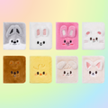 Set of colorful plush toys with animal faces on a gradient background